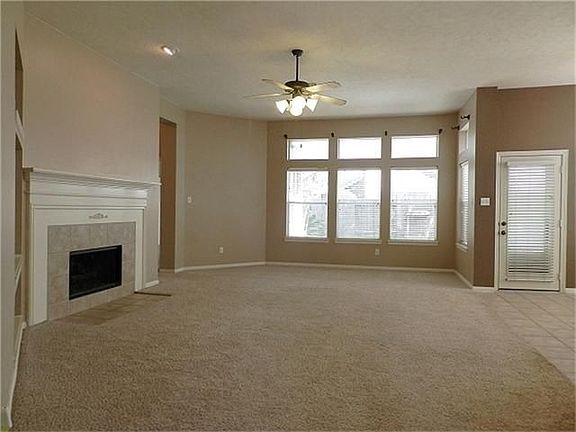 Wow! Living room with built-ins, fireplace and just look at those windows!