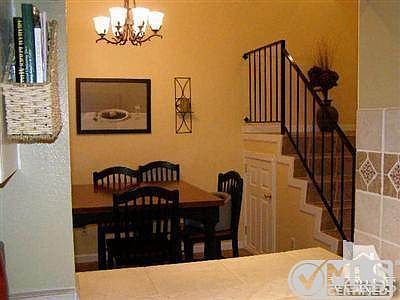 Dining room/living room with vaulted ceilings.