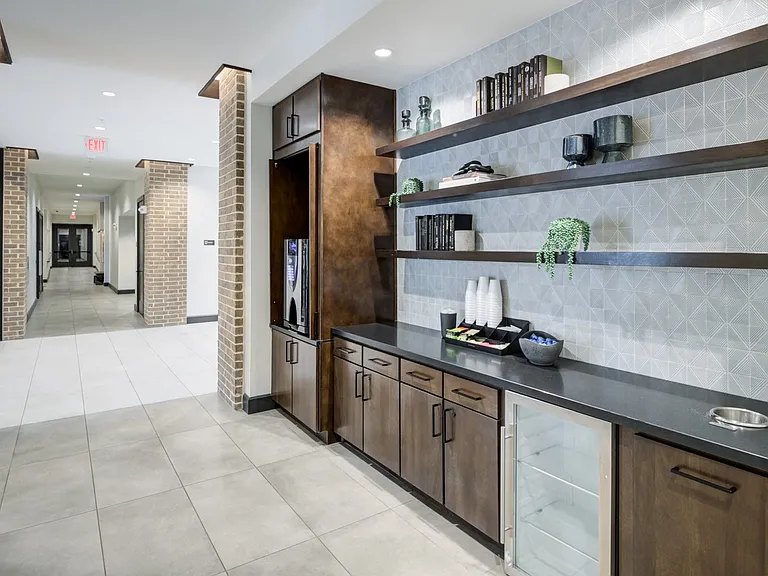 Resident Beverage Station With Open Shelving and Sleek Countertops