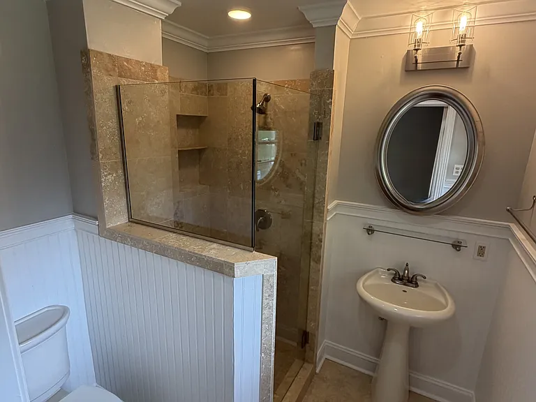 Master bathroom, connected to master bedroom. Spacious marble shower, Mirrored medicine cabinet