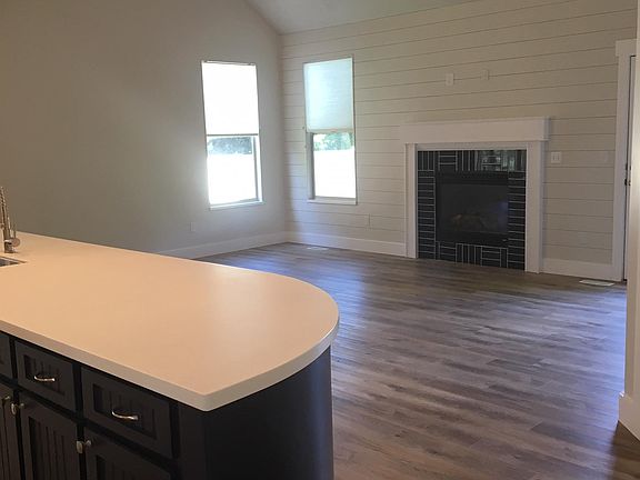 Open concept kitchen/family room with gas fireplace