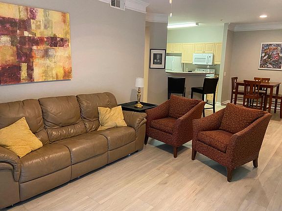 View of living room towards kitchen area.