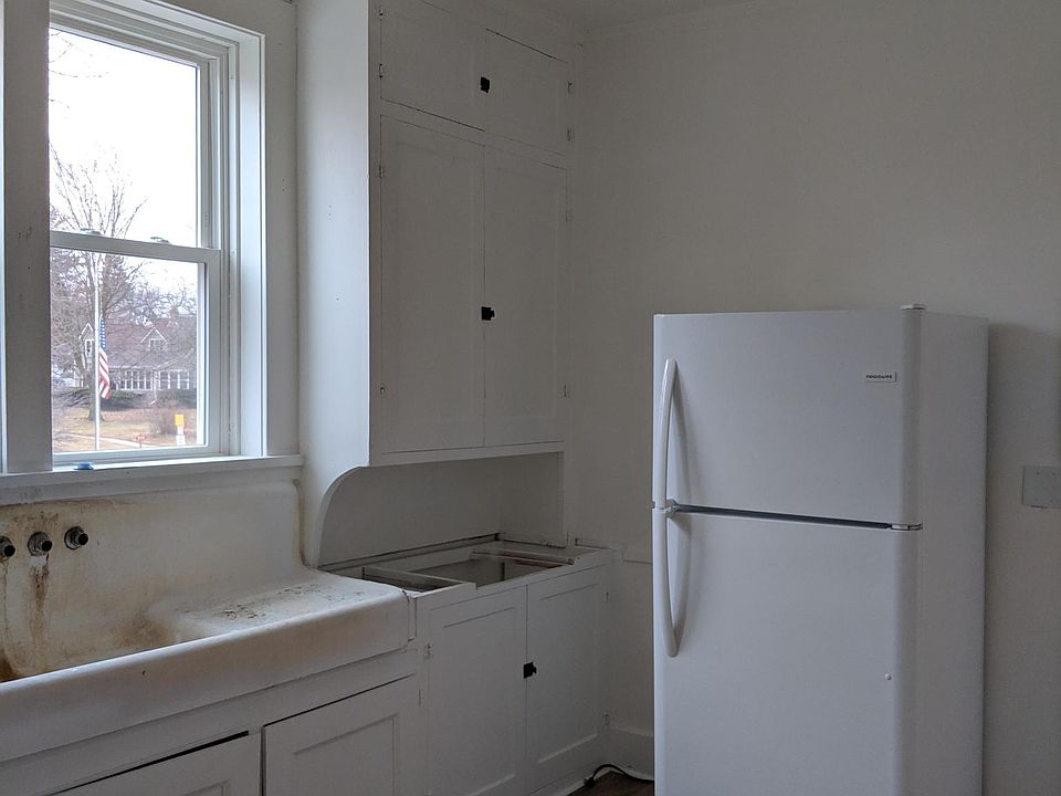 New kitchen windows and frig. Sink has been refinished with new tops to be installed.