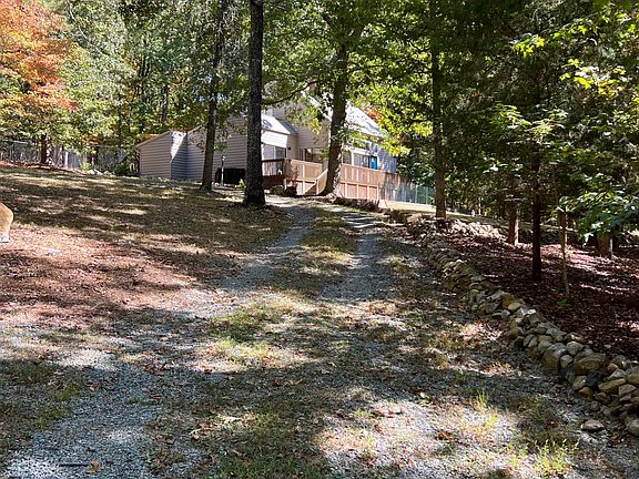 View further down the driveway where it branches off from shared easement portion with neighbor.