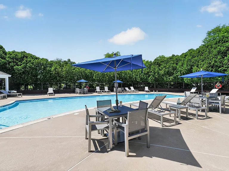 Unwind by the refreshing pool at Eagle Rock Apartments at Enfield, where serene views and comfortable lounging await. Perfect for a sunny day, it's your ideal spot to relax or socialize. Schedule a visit today to see it for yourself!