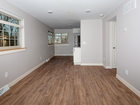 Laminate flooring throughout the apartment.