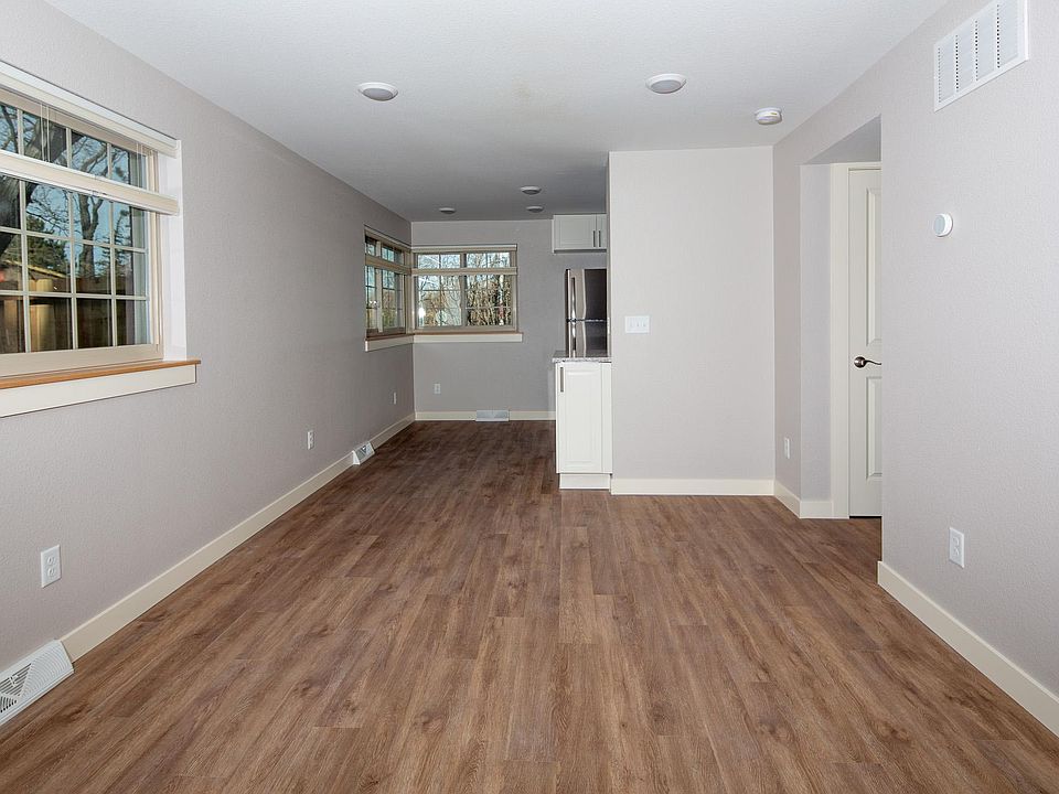 Laminate flooring throughout the apartment.