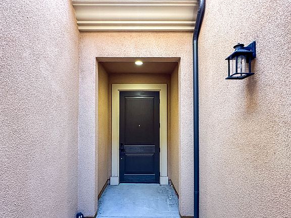 A cozy courtyard leads to the front door.