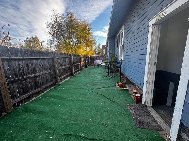 Private side yard attached to basement bedroom. Private entrance.