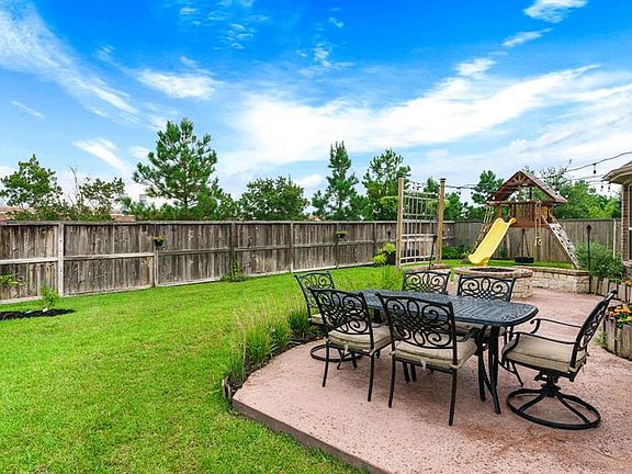 This is the backyard everyone wants! Plenty of green space, spacious patio, firepit - and no back neighbors!