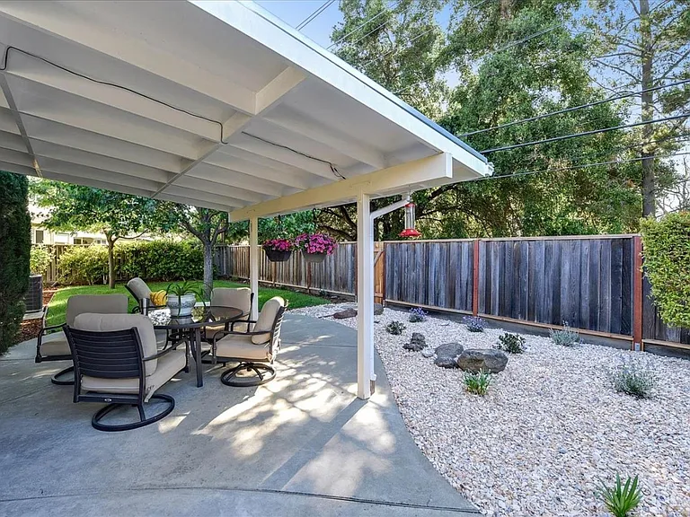 **Backyard**

Relax in the spacious private backyard with a lush lawn, mature trees, and plenty of room to unwind or enjoy the California sunshine.