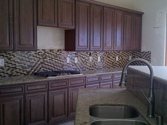 Custom Kitchen with Granite and Glass Backsplash!