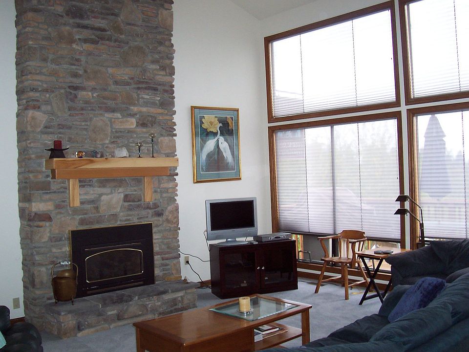 Updated Living Room with Stone Fireplace