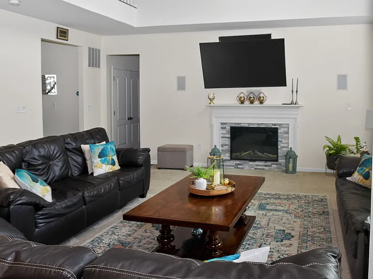 Livingroom _ Shown furnished. If a furnished rental arrangement is agreed upon, the room would be presented as shown.
