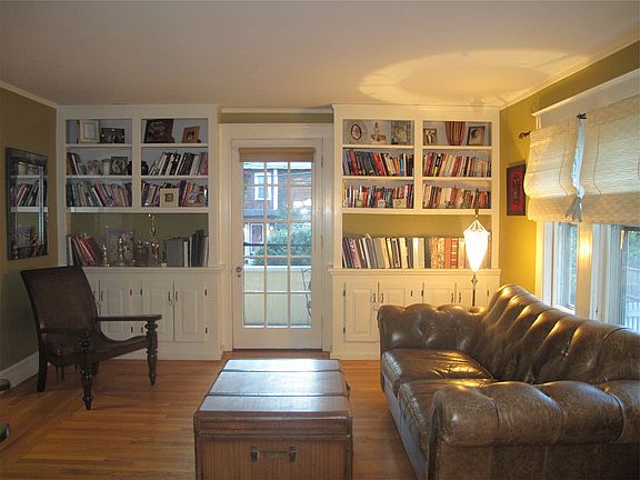 Living room, featuring built in bookshelves