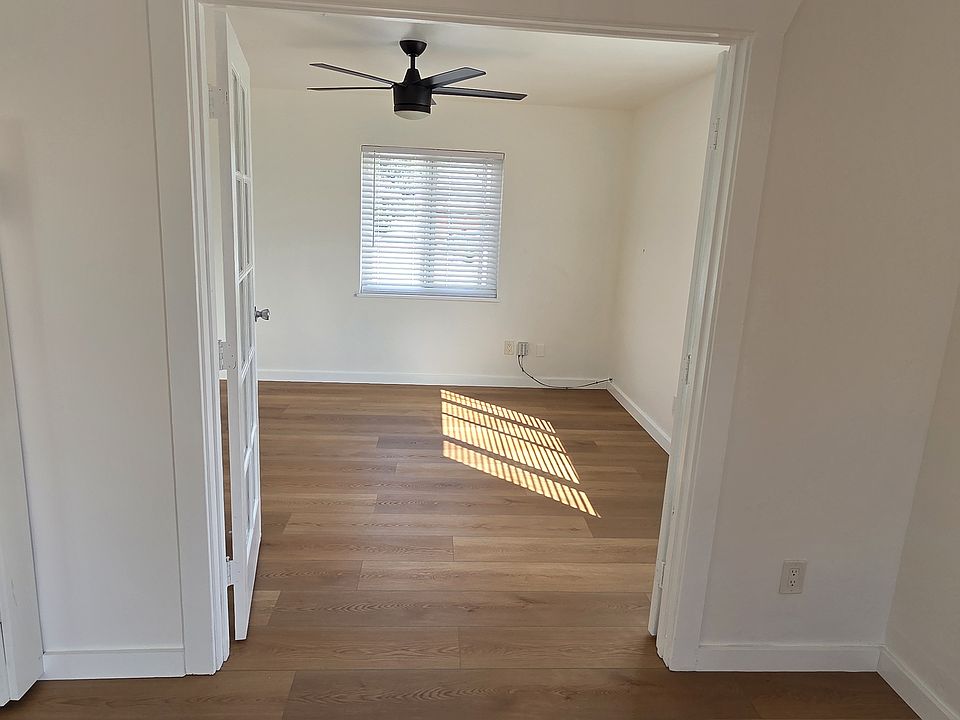 View of flex room from Living Room with doors open