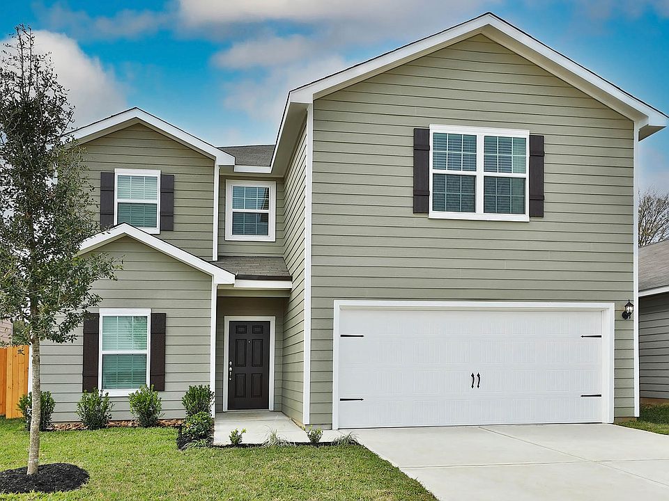 This beautiful two story home has siding and front yard landscaping