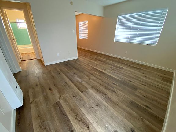 Living room looking into the kitchen and bathroom