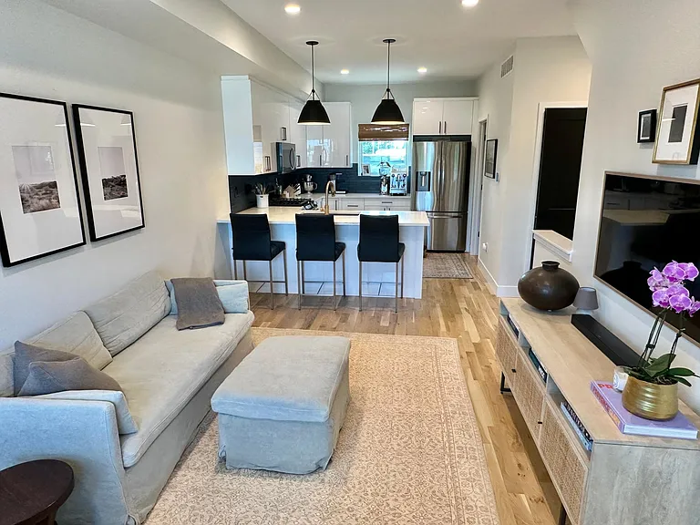 Oak hardwood floors and dimmable overhead canned lights