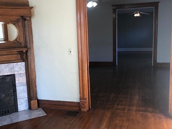 Standing in living room looking at family room and dinning r