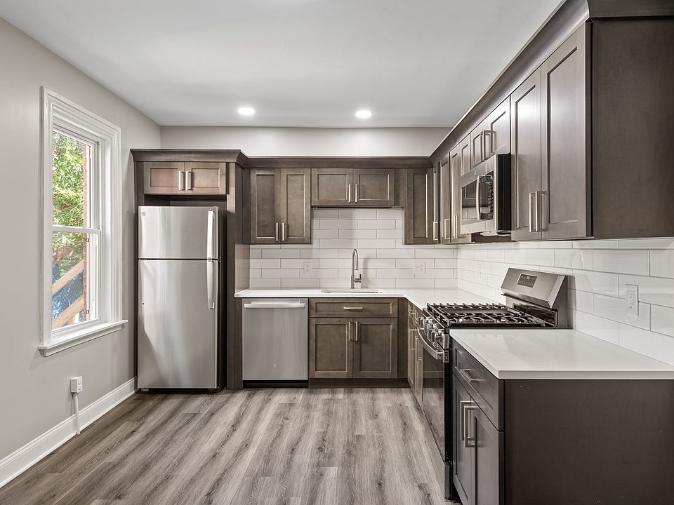 Kitchen with gas stove and dishwasher. Quartz contertops and upgraded cabinets.