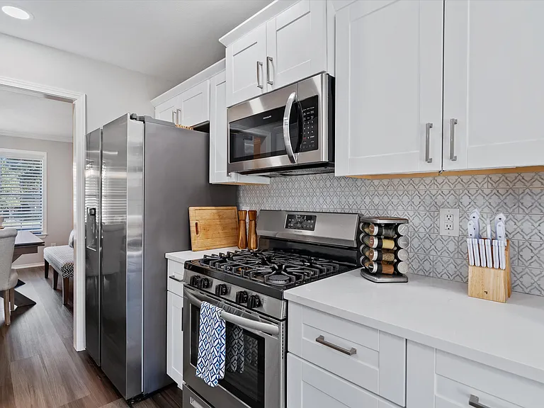 Open Concept Kitchen with all brand new appliances and Island Seating for 4 and breakfast table and extra storage in breakfast area.