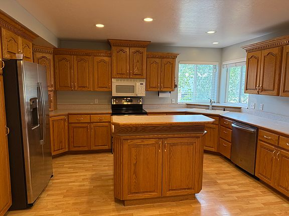Kitchen with pantry, newer appliances, and lots of cabinets.