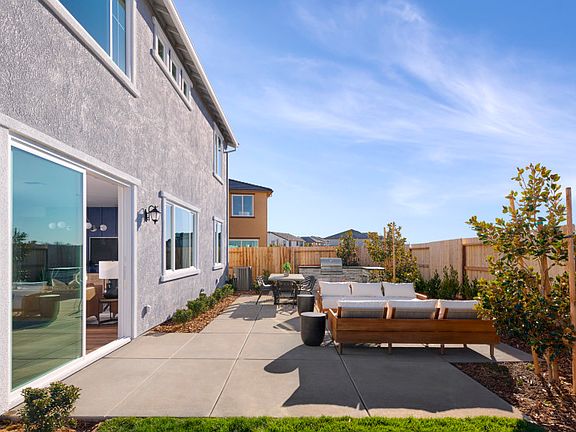 Back patio offering indoor outdoor living