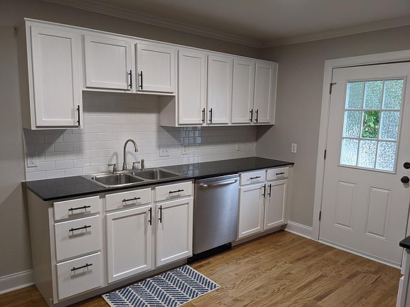 Recently refreshed kitchen - New tile backsplash, new faucet and disposal, and refinished cabinets. Quartz countertops are great for easy cleanup.