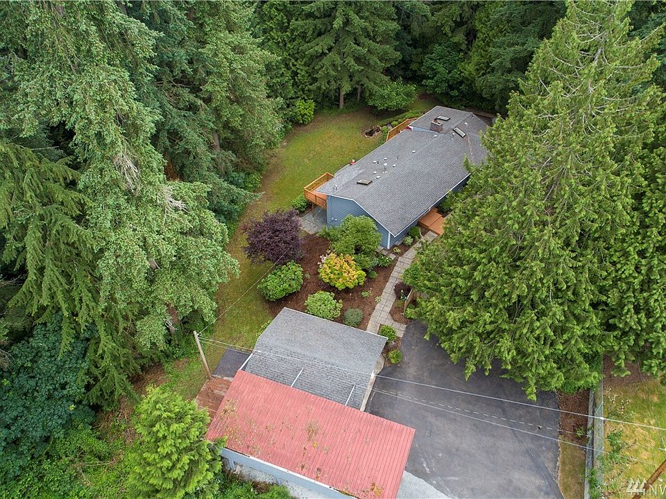 Welcome home to Benson Hill! This gorgeous, welcoming home is situated on a secluded 1.14 acre parcel that will make you feel like you've escaped to a private oasis with beautiful landscaping at every turn. Inside, the updated spaces and abundant windows, glass French doors and skylights bring in light and connect you to the outdoors. 