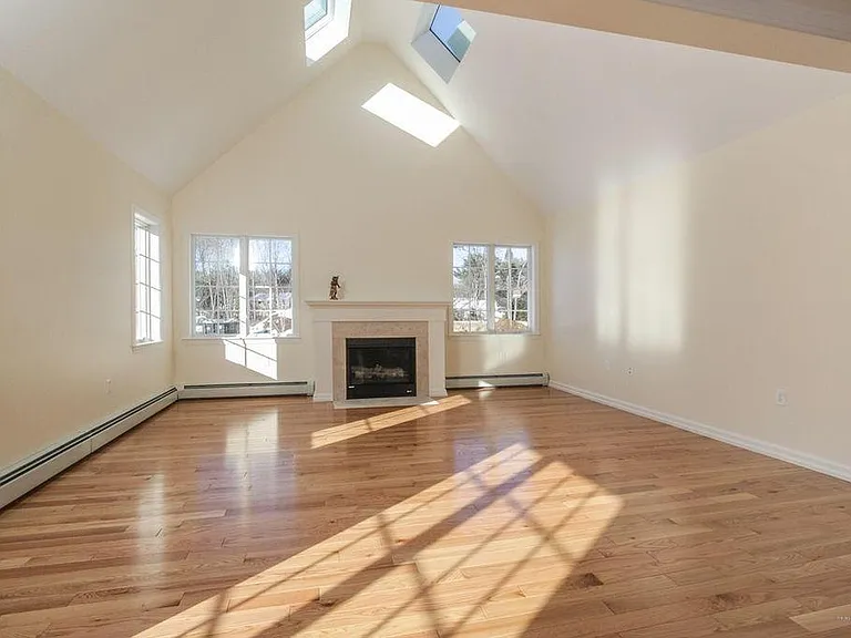 Living room with skylights and gas fireplace