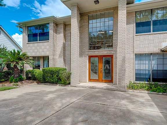 This is closer view of this two story charmer with lots of natural lighting.