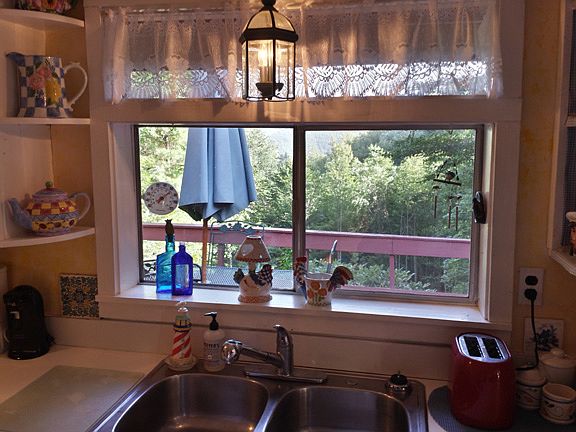 Kitchen looks out to deck
