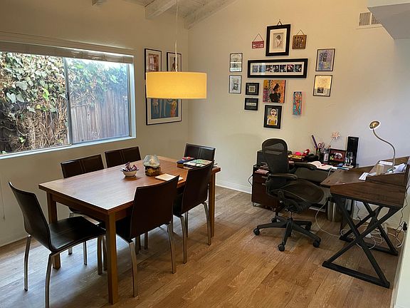 Living Room adjacent to dining and kitchen areas