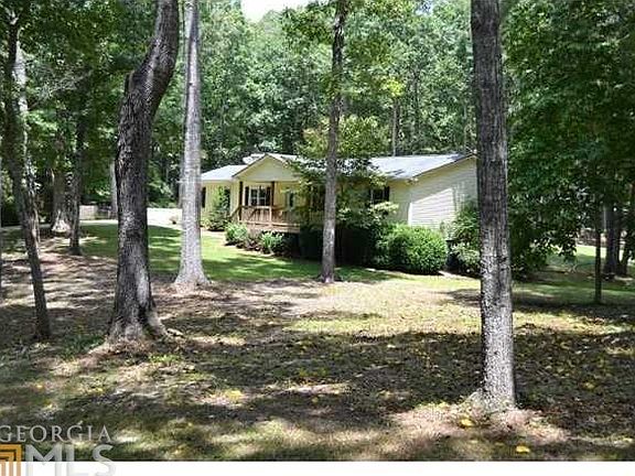 Peaceful 5+ acres of level, grassy lawn & dappled hardwoods in sought-after Cherokee County!