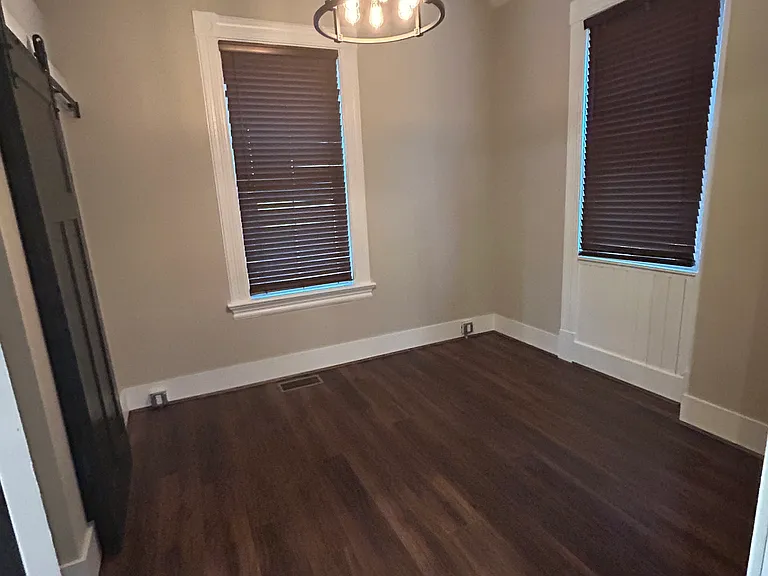 Bedroom with two windows and nice sized closet.