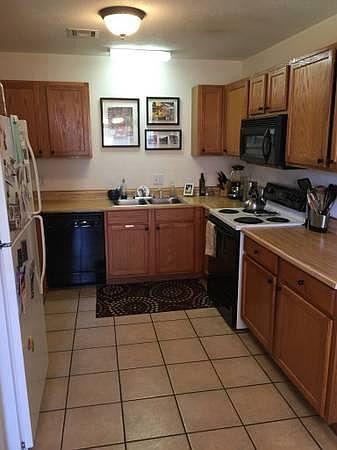 Spacious kitchen with lots of cabinet storage.