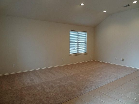 Another view of the formal living & dining (taken from the front door.)  The room has ample space for not only a full living room set of furniture & dining table, but enough wall space for a China hutch and serving buffet.  Wired for surround sound.