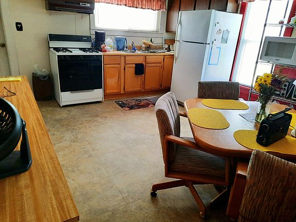 Kitchen has room to add a desk, additional storage shelving, or a coffee bar if you like.