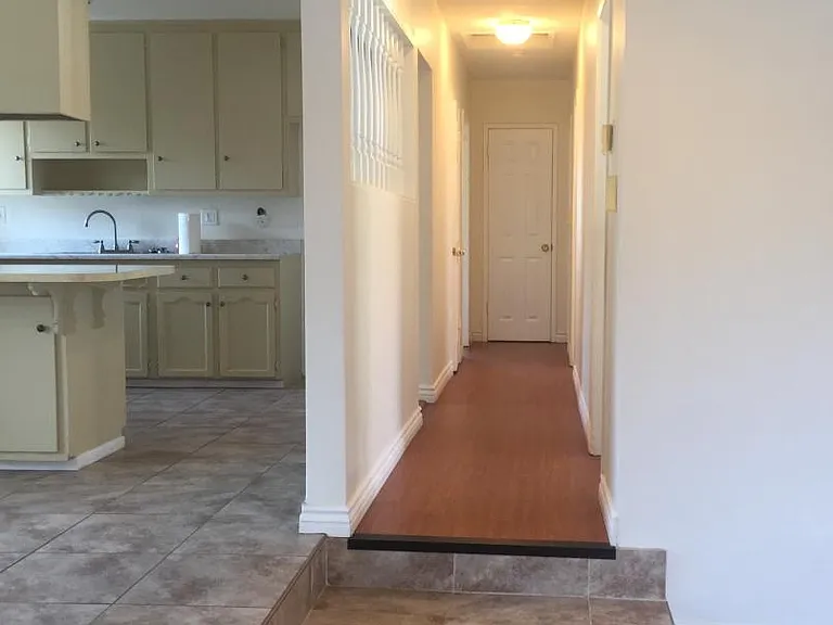 Hallway to three bedrooms