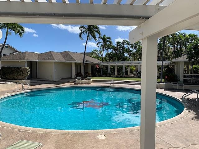 Swimming pool for Arbors residents and guests. BBQ area and bathroom with showers