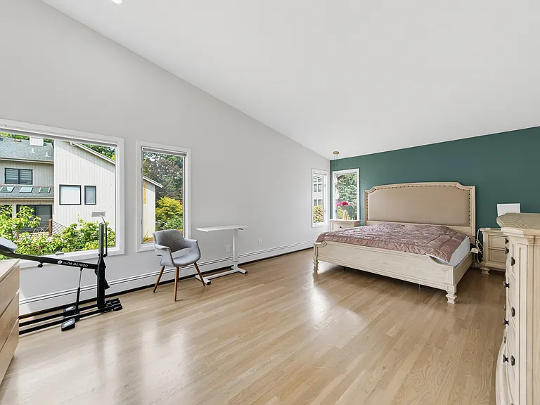 PRIMARY BEDROOM WITH VALTED CEILING AND POINTED LIGHTING