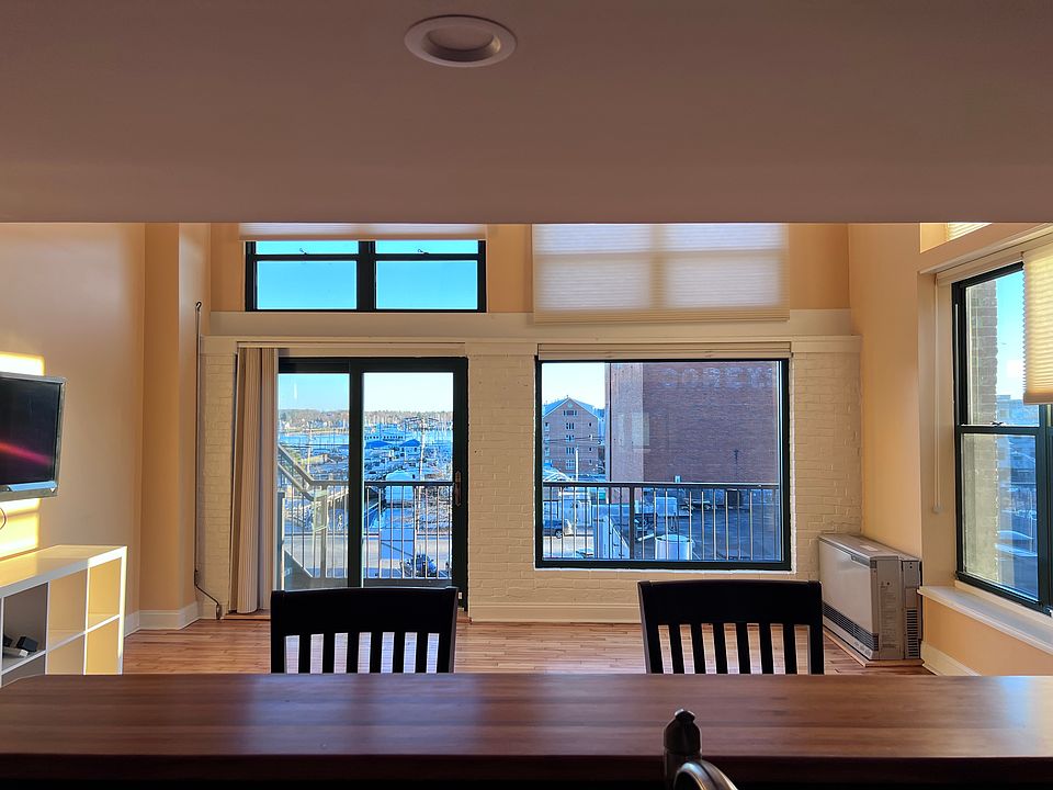 Kitchen, looking towards living room with harbor views
