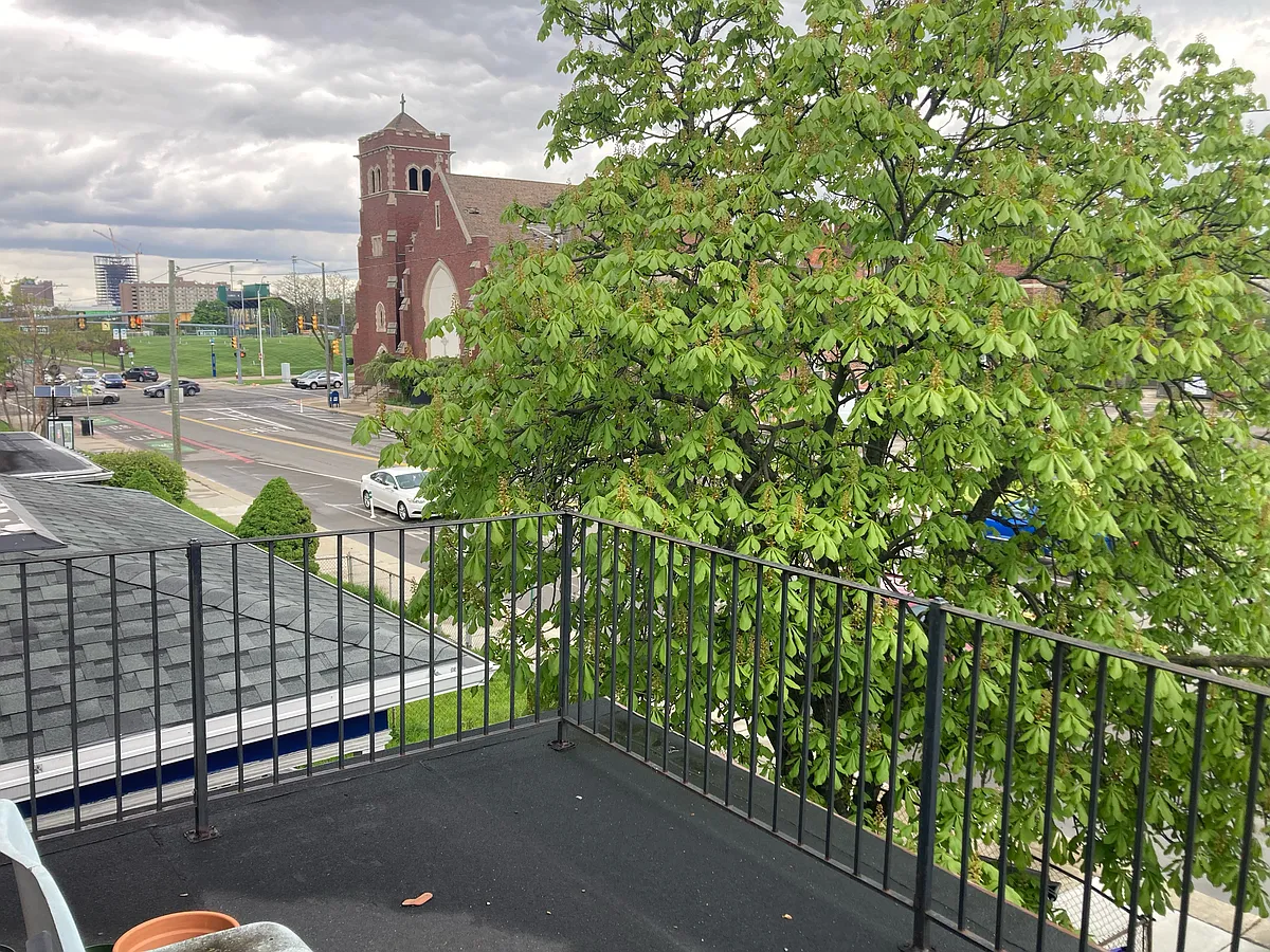 front porch with view of Old St Dominic's church - 4815 Trumbull St #U
