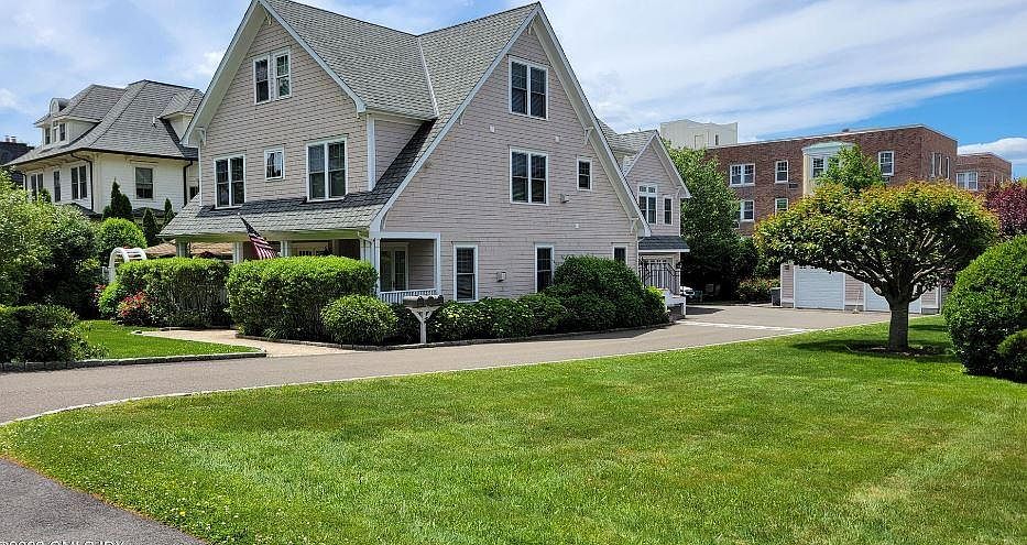 Front Entrance and Views of Beautifully Landscaped Yard
