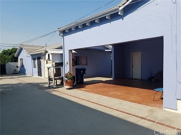 Carport and view of back unit