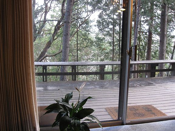 Insulated Full Sliding doors open to expansive deck with built in seating.