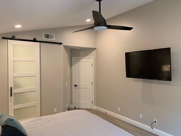 Ceiling fans throughout and large smart TV