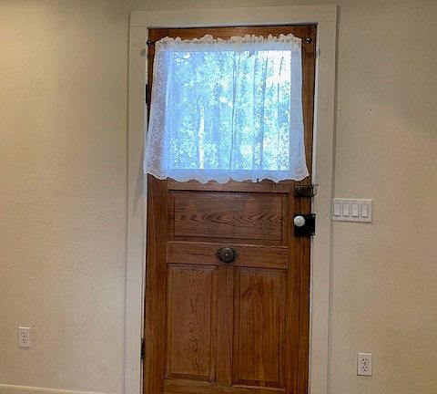 Front rooms leads back to kitchen & bathroom with washer & dryer.
