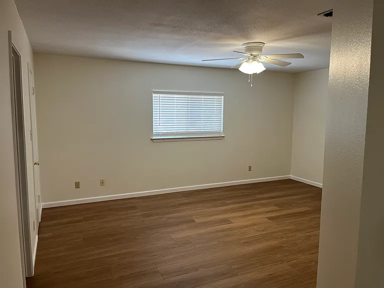 Master bedroom with a walk-in closet and convenient bathroom access